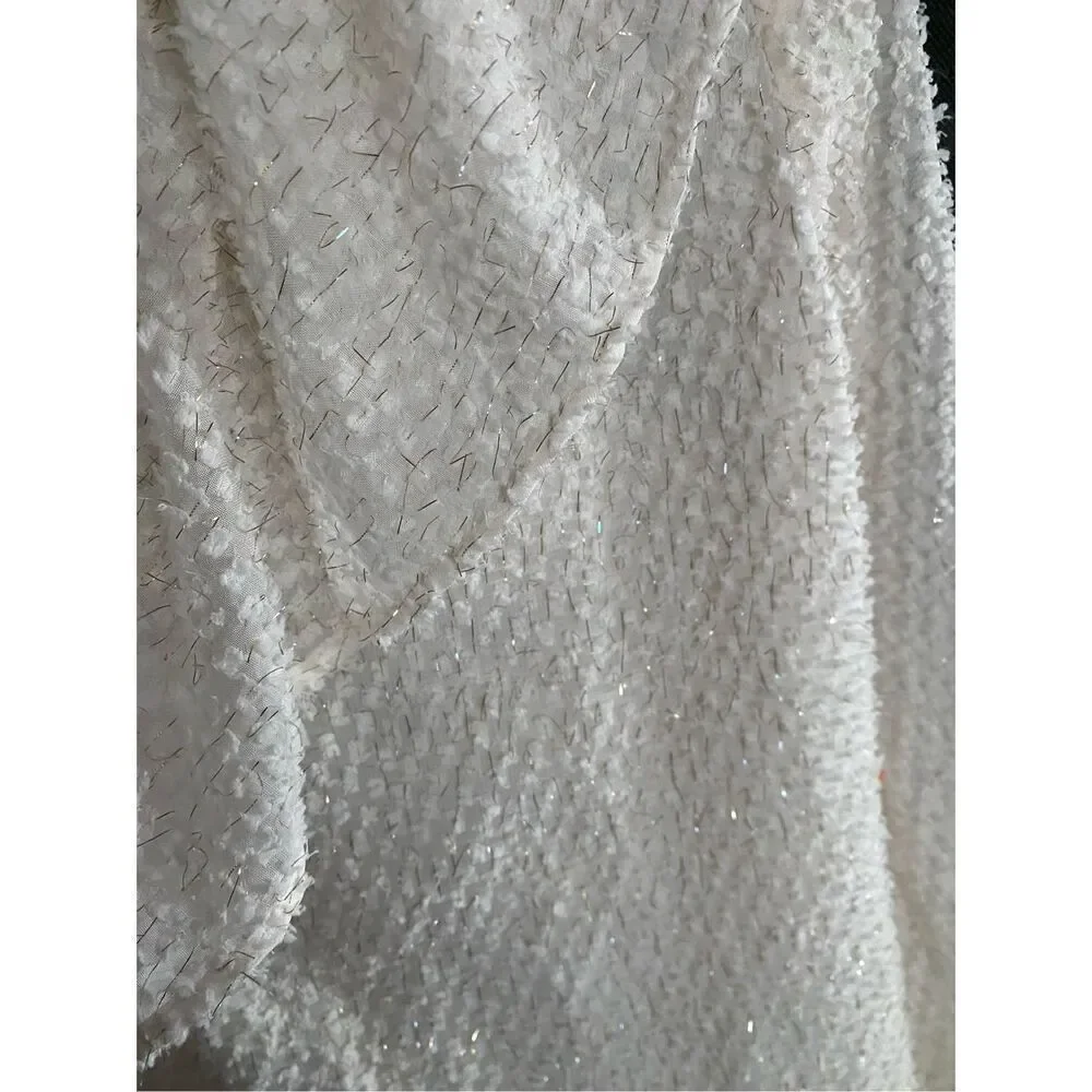Loft white and gold shimmer ruffle Swiss.blouse size medium.￼